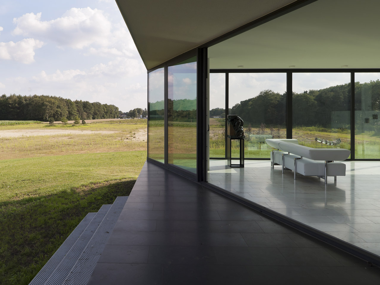 The morning patio, facing east. Created by setting back the glass front
