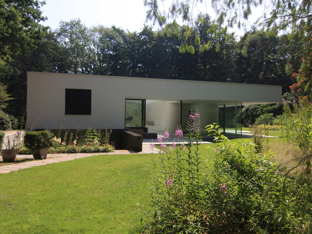 Health House with a bright white stucco that has a dirt-resistant coating