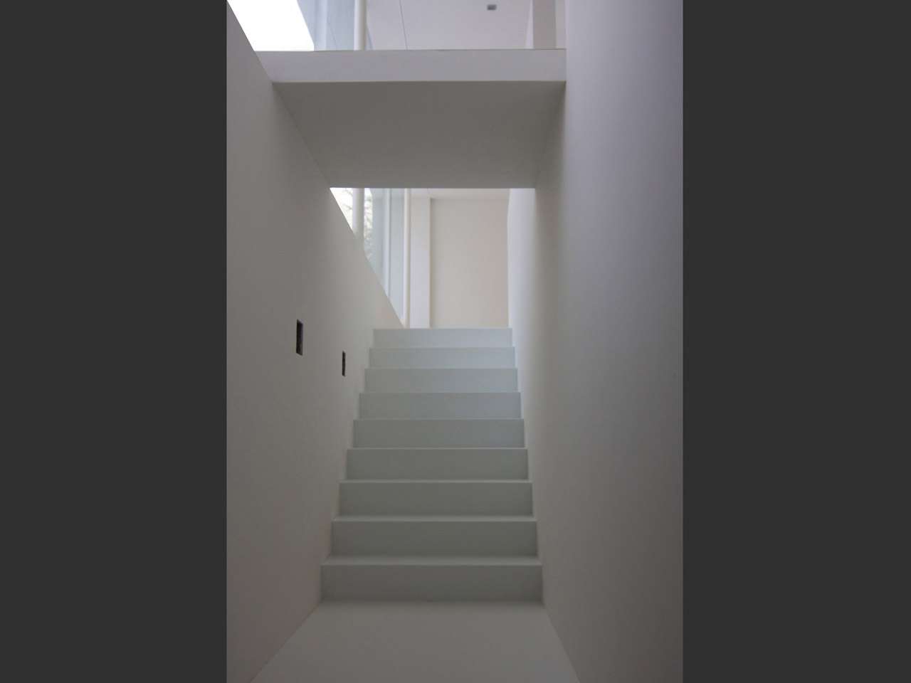 The stairway leading from the underground garage into the living area